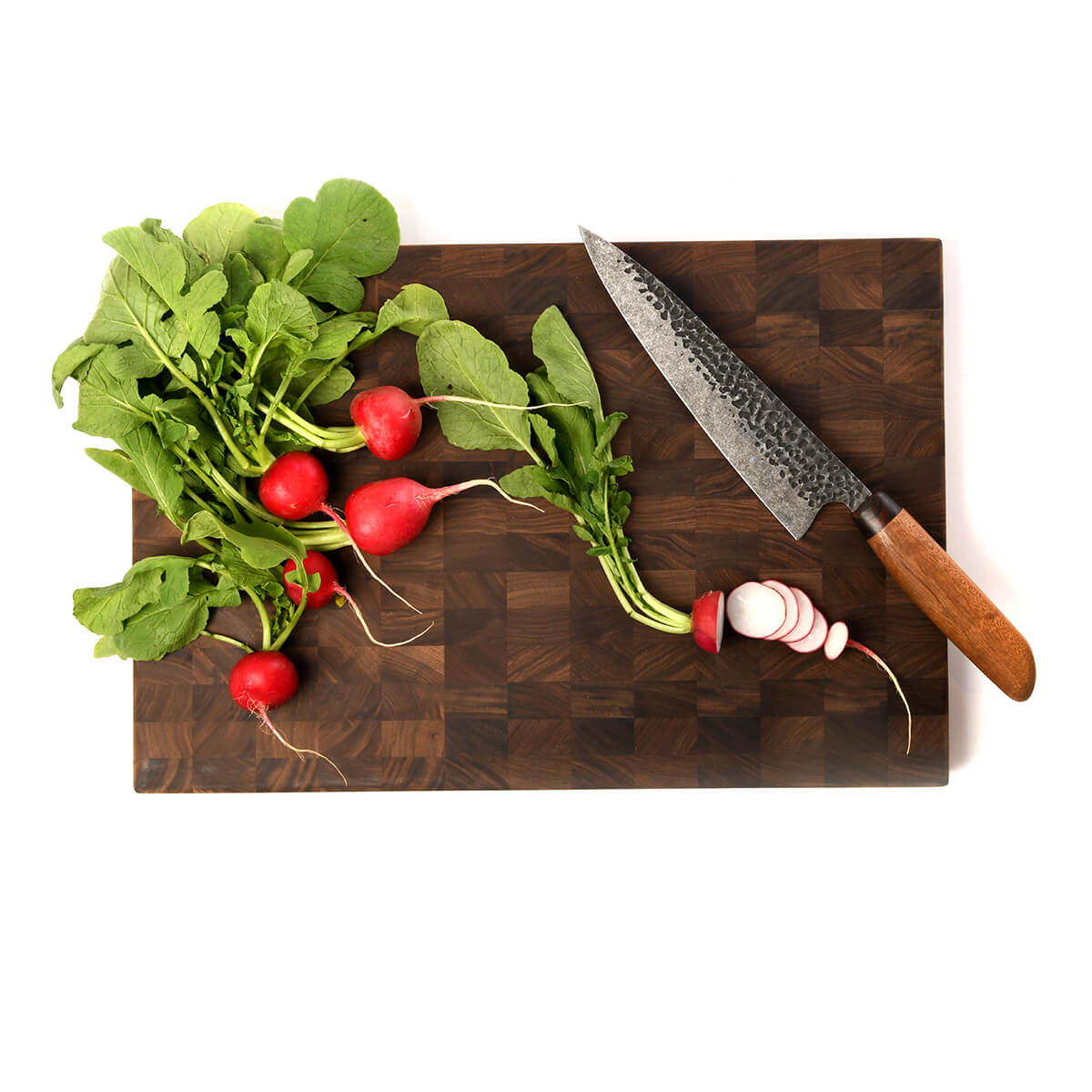 cutting radishes on cutting board made from end grain walnut