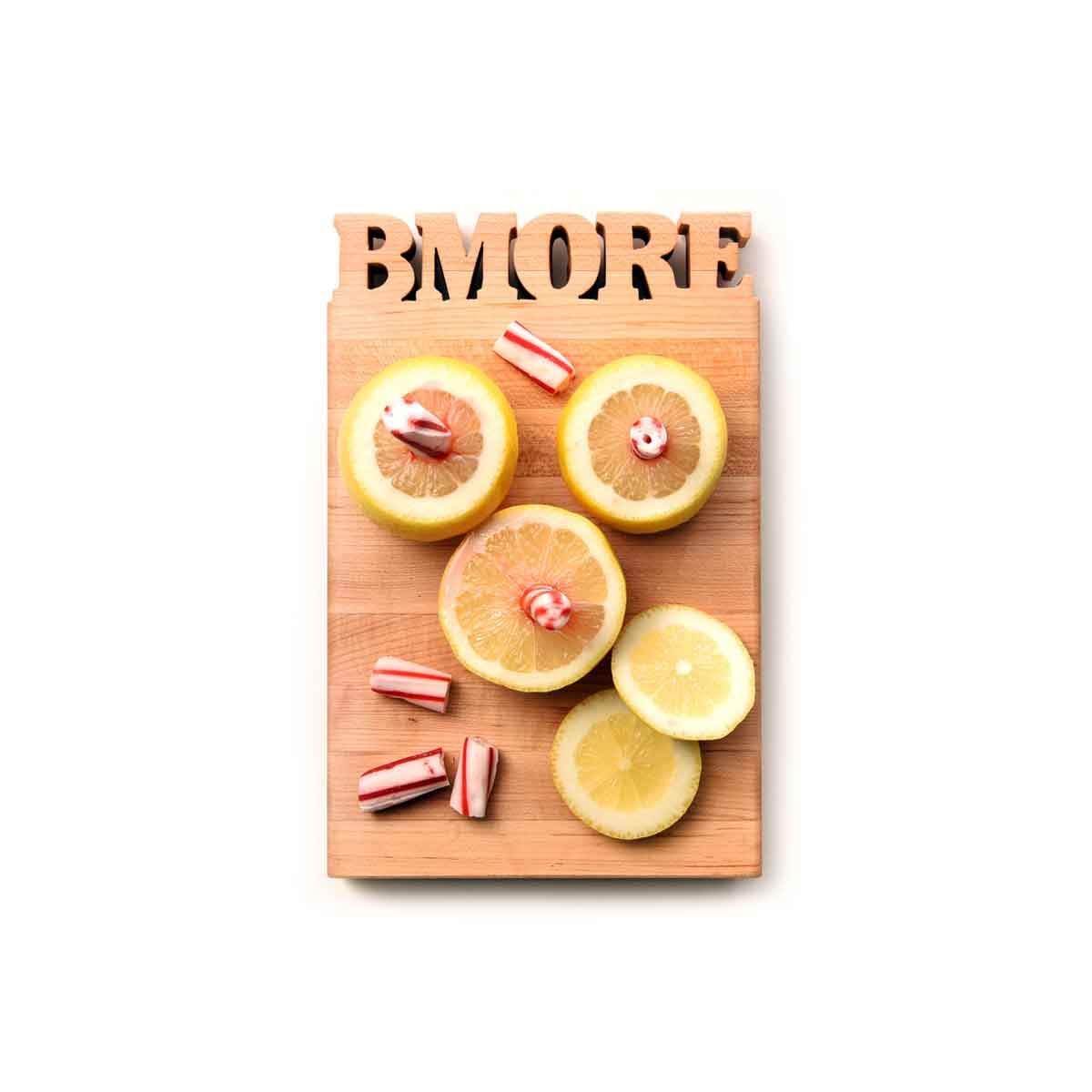 Mini cutting board - wood with the word BMORE cut out of thop- bottle opener