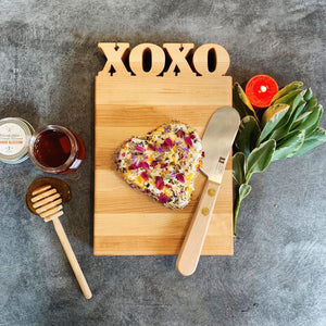 XOXO Cutting Board with food on it