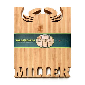 crab cutting board with names carved out of maple wood