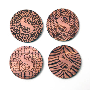 Personalized coaster set, single initial letter S over animal print, cedar wood