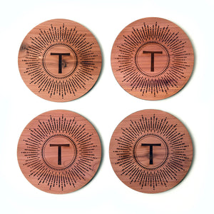 Set of 4 personalized coasters, starburst and initial T engraved on cedar wood