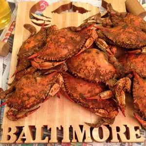 crab cutting board with steamed crabs on top