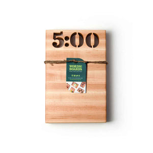 cutting board that says 5oclock - 5 0 0 cut out of the wood
