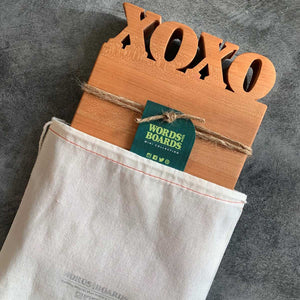 XOXO cutting board coming out of custom Words with Board Bag