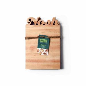 maple wood cutting board with the word Nosh cut out of the top