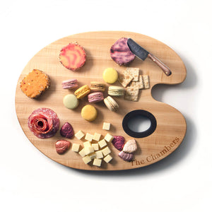 personalized paint palette serving board with a display of cheese and crackers