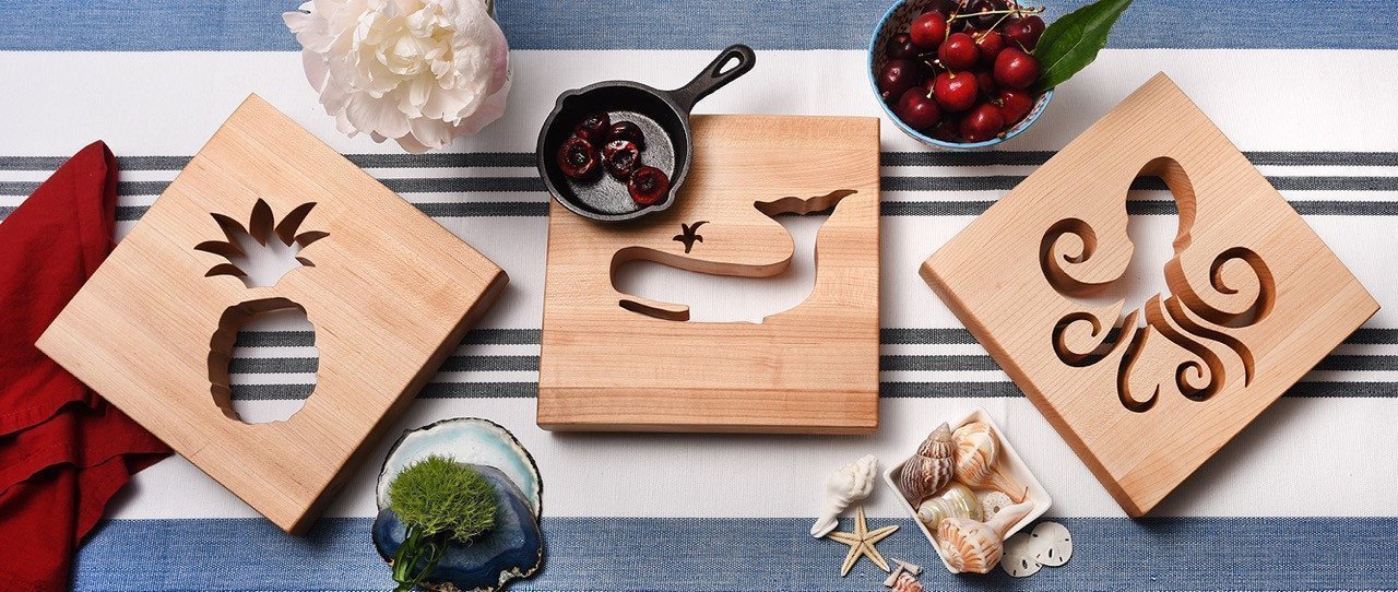 3 Wooden Trivets each with its own cut out - pineapple, whale, octopus, on blue and white background