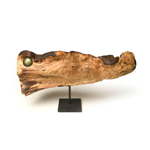 Crocodile sculpted out of cypress rood