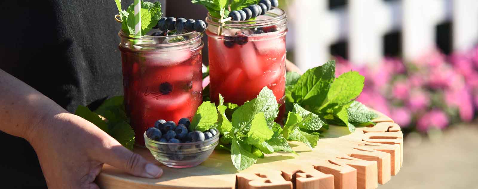 Round Cutting Board with Drinks on it 