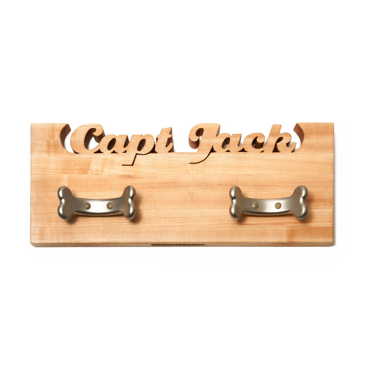 Wooden plaque with 'Capt Jack' engraving and two metal hooks on a white background