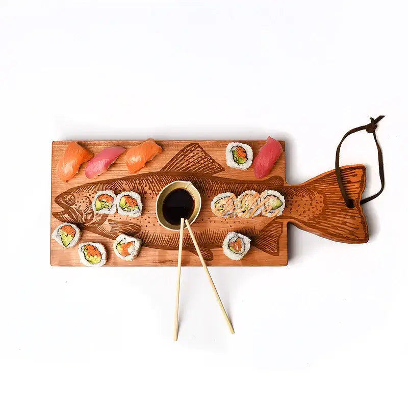 Trout fish shaped cutting board, shown with sushi