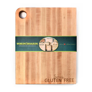Wooden rectangle cutting board with 'laser engraved words 'Seriously Gluten Free' on lower right corner.