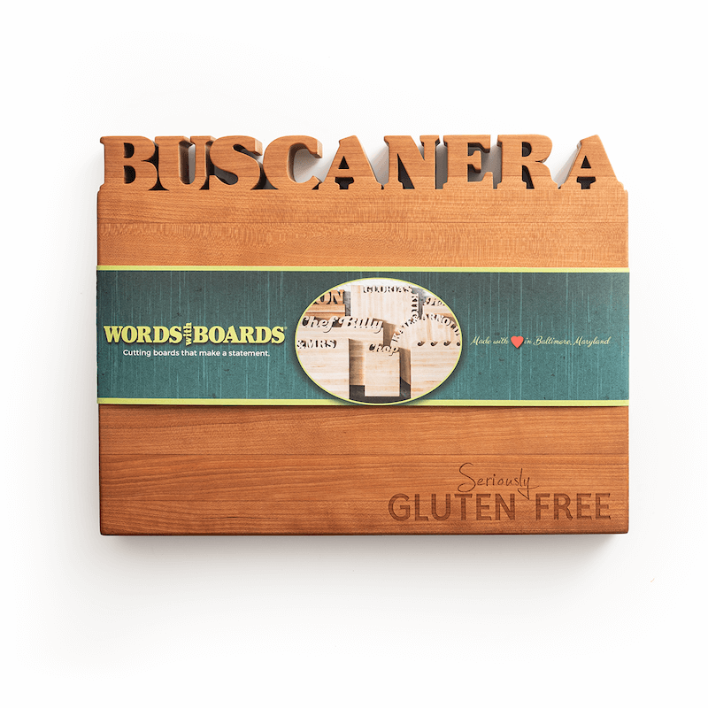 Wooden gluten free gifts with 'Buscanera' cut out and 'Seriously Gluten Free' laser engraved  on wood cutting board on a white background