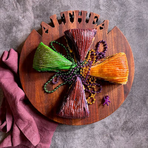 round custom cutting board, king cake being served