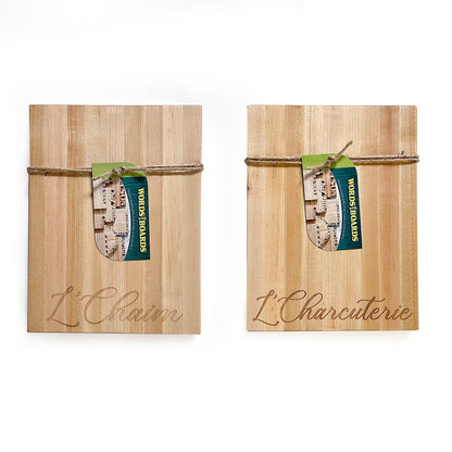 one wooden cutting board with  laser engraved words 'L'Charcuterie' on one side and 'L' Charcuterie' on the other sideon a white background