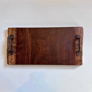 Wooden tray with metal handles on top on a white background