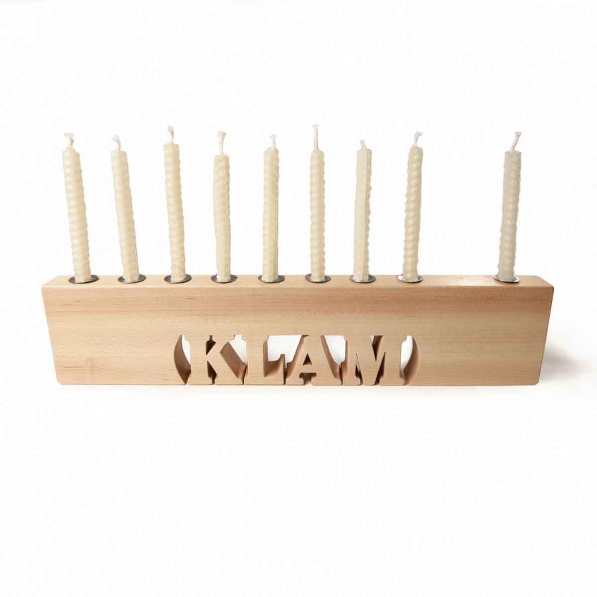 Wooden menorah with candles on a white background