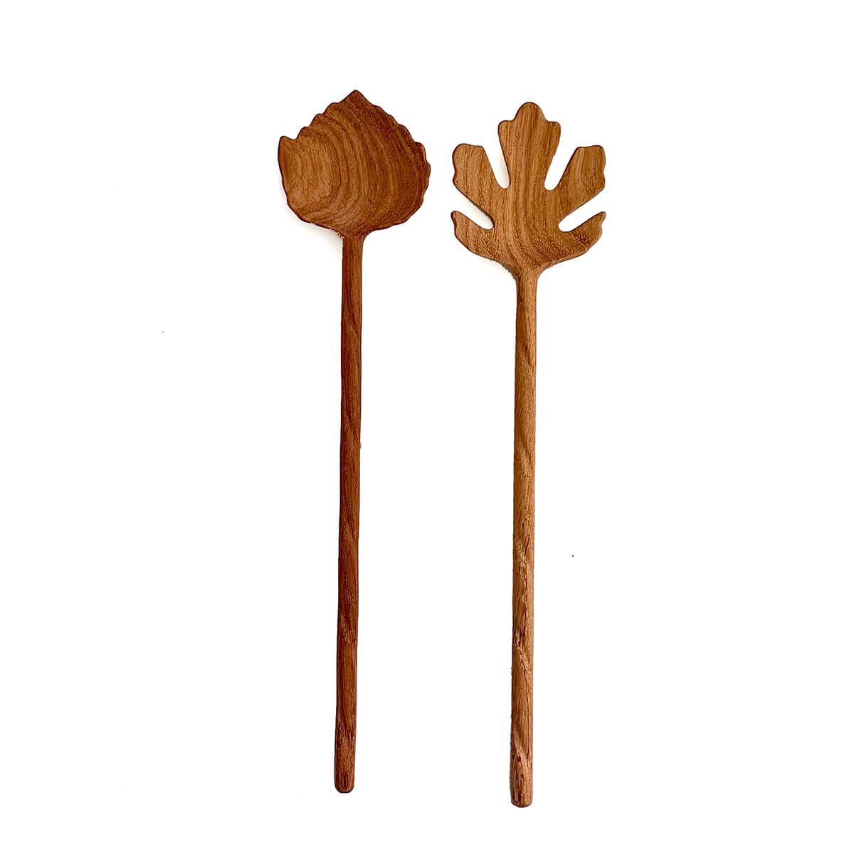 Two wooden salad servers with leaf-shaped ends on a white background