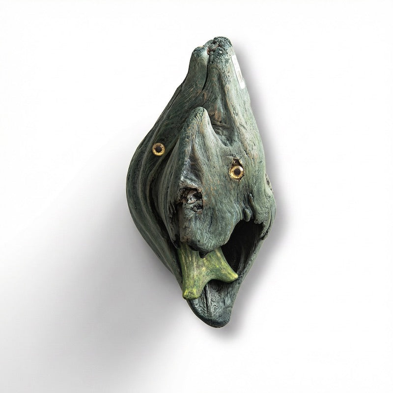 Decorative fish sculpture with reptile tongue greenish-brown color on a white background