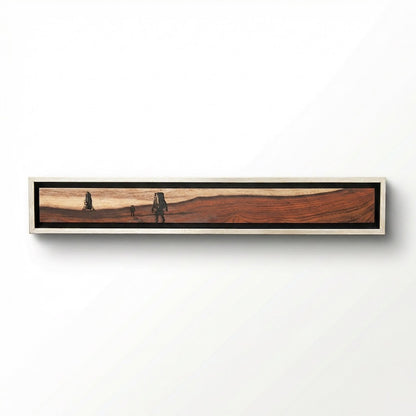 Long, narrow wood piece an astronaut and mav laser engraved with a silver frame on a white background
