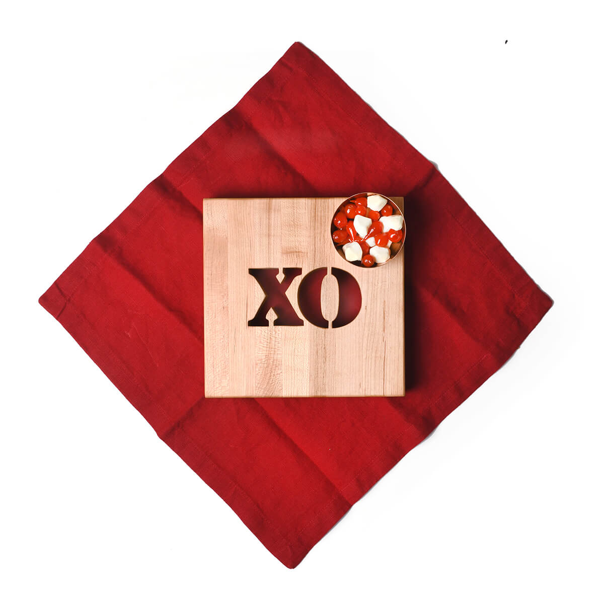 wooden trivet - XO cut out on middle