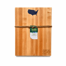 Wooden cutting board with USA shape inlaid with lapis and 'Words with Boards' tag on a white background