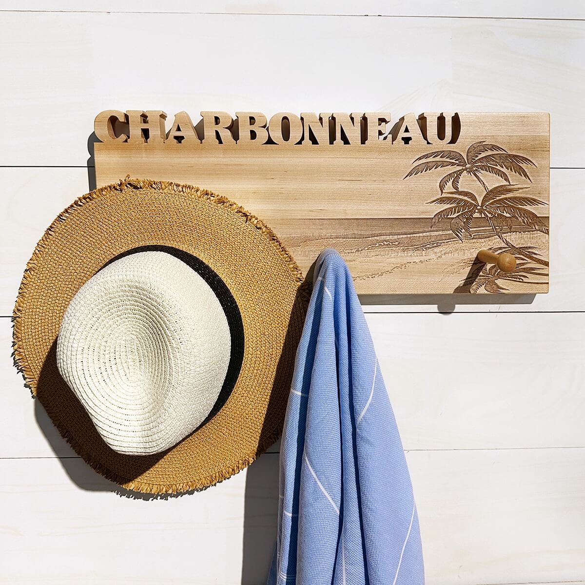 wood coat rack with 3 pegs for hanging hats, towels, etc
