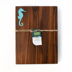 turquoise stone inlay of seahorse, walnut cutting board