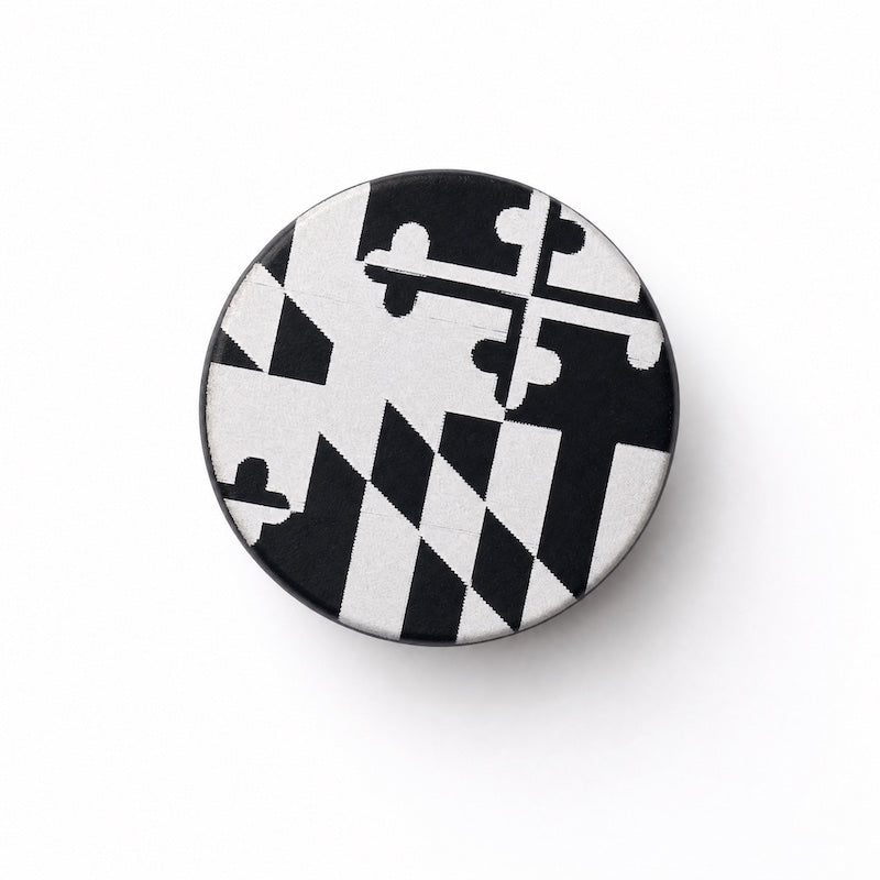 black bottle top, engraved Maryland flag white background