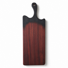 black Wood cutting board with a dark handle and gradients to wood color on a white background