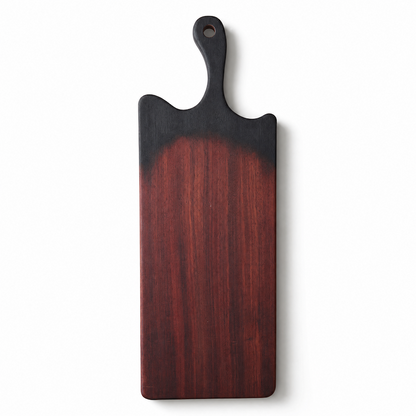 black Wood cutting board with a dark handle and gradients to wood color on a white background