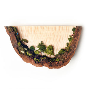 miniature climber people inside U shaped tree bark, wall art