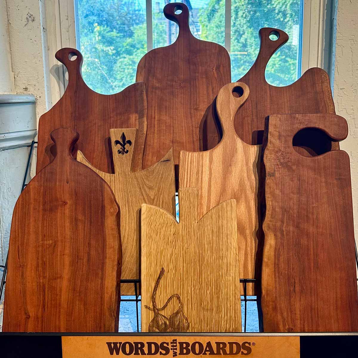 collection of live edge cutting board with handle, cherry and oak wood