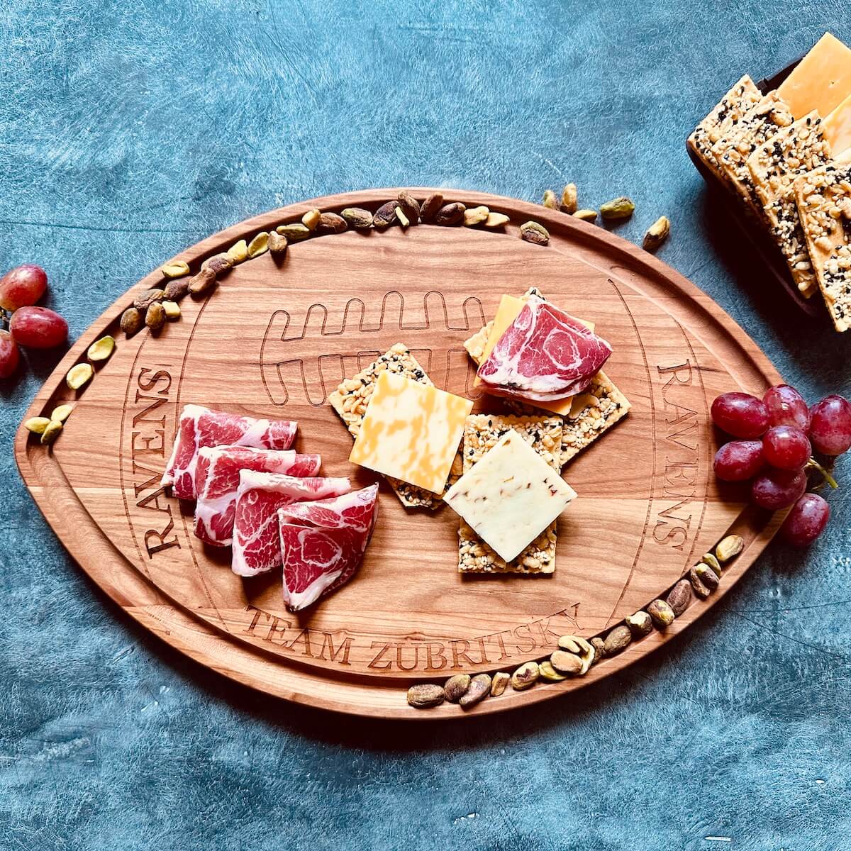 personalized football shaped charcuterie board, cherry wood