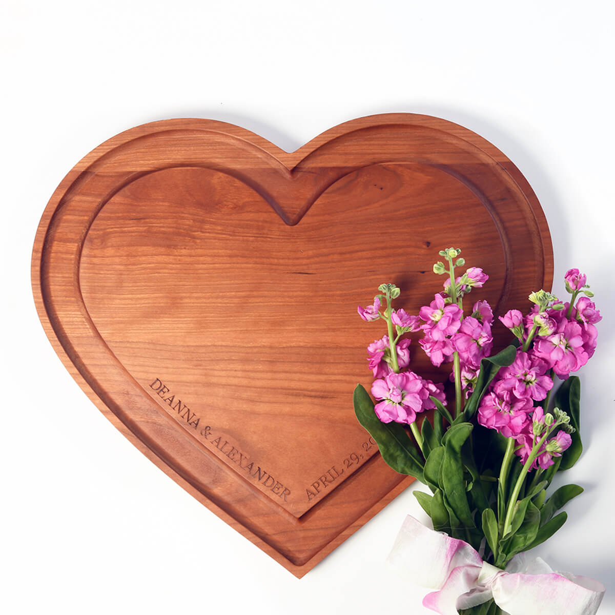 wooden heart shaped charcuterie board with groove