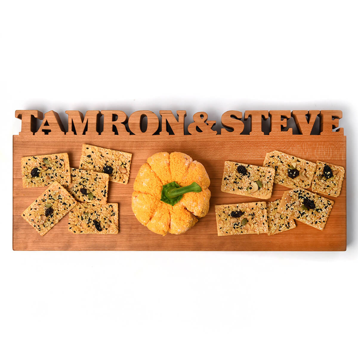 walnut wood serving board with words carved out