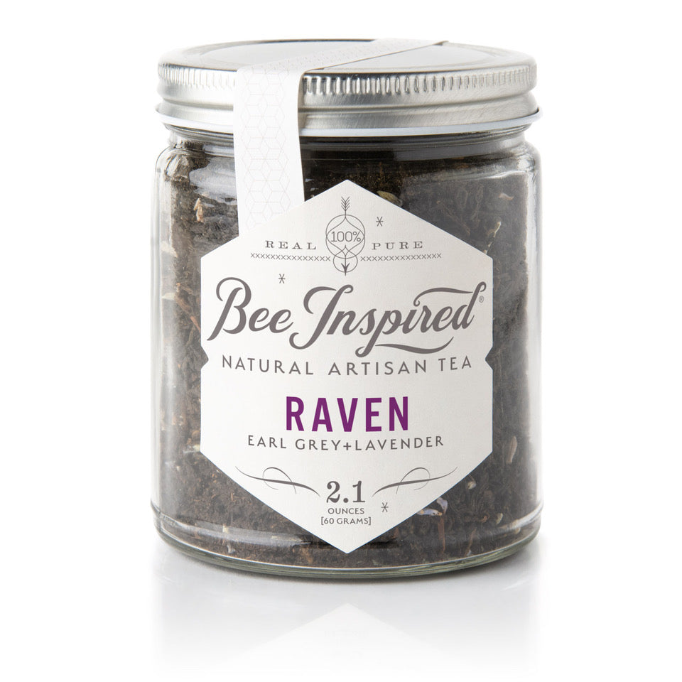 loose tea in glass jar with label, white background