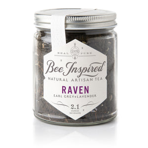 loose tea in glass jar with label, white background