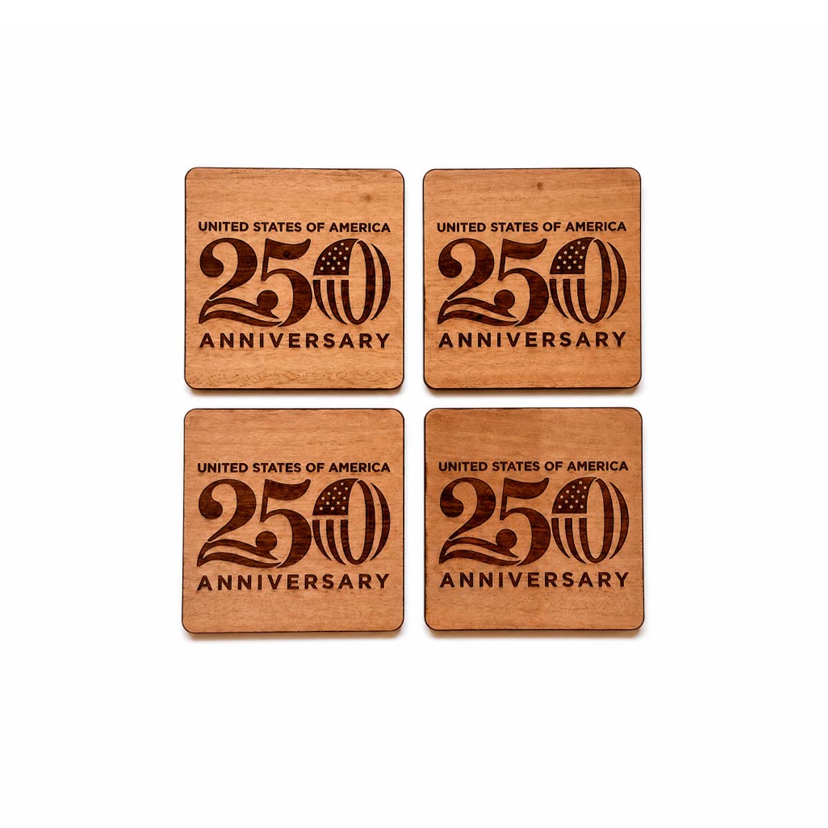 Four wooden coasters with 'United States of America 250th Anniversary' engraving on a white background.