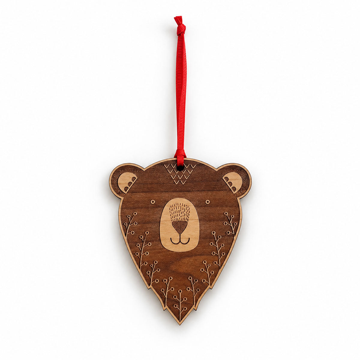 A wooden bear head hanging ornament with a red ribbon loop, featuring laser-engraved details on a plain white background.