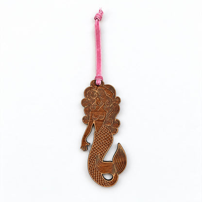 mermaid wooden holiday ornament with velvet pink tie, white background