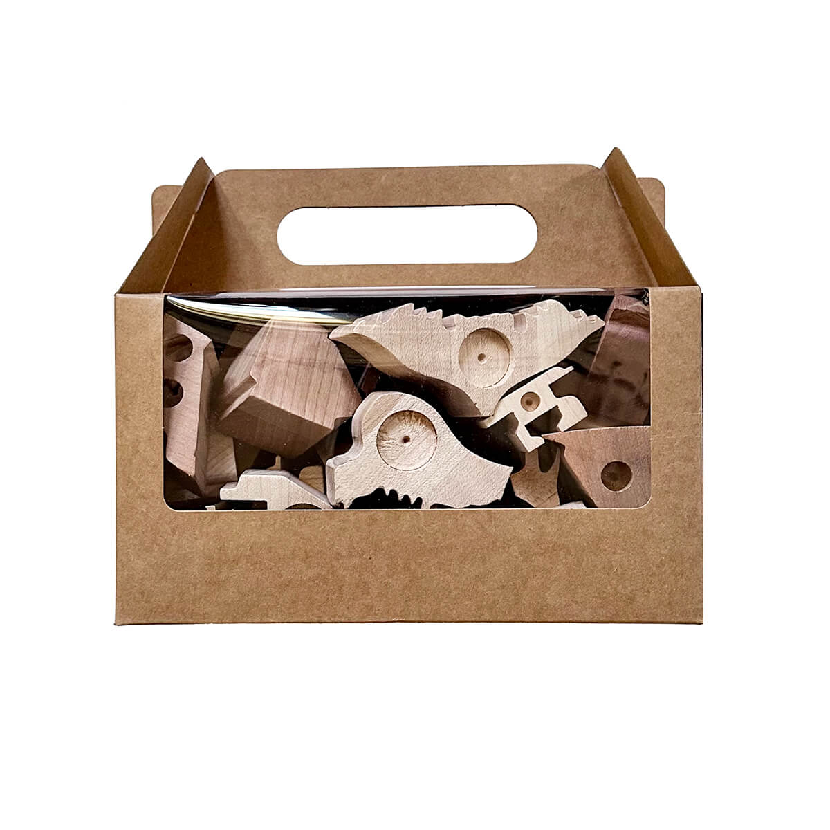 Wooden toy pieces in a brown cardboard box on a white background