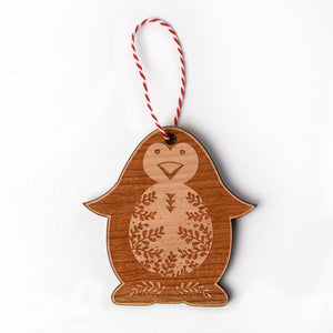 penguin shaped wooden holiday ornament