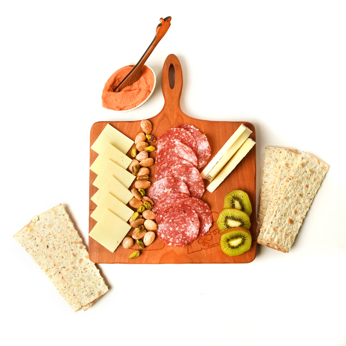 Cheese board with handle, shown with cheese and salami