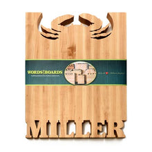 crab cutting board with names carved out of maple wood