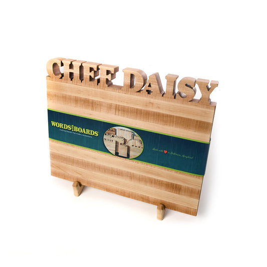 cutting board holder, shown holding a cutting board, maple wood
