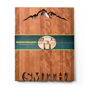 Large personalized cutting board, names cut to of bottom, mountain shape cut out top of cherry wood