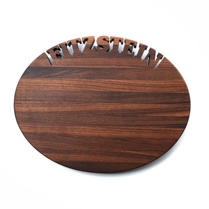 Oval personalized cutting board with Fitzstein cut out of top 