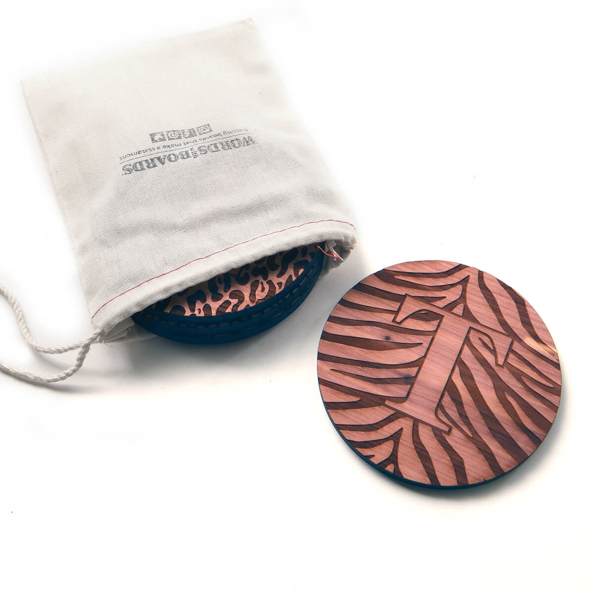 Personalized coaster with the letter T over animal print, cedar wood